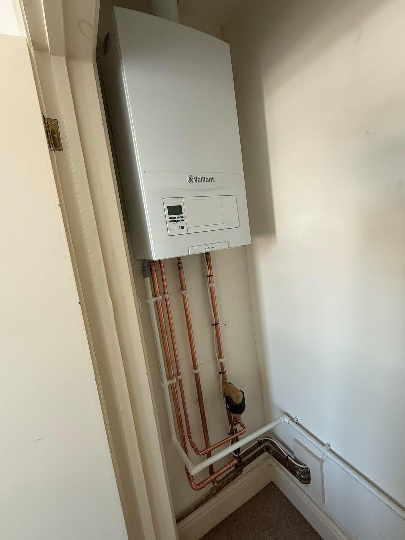 Vokera boiler with copper pipework in a cupboard